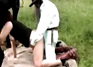 Busty Lady Pleasing a Mare in Natural Zoo Setting