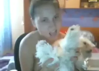 Cute zoophile lets dog suck on her big tits